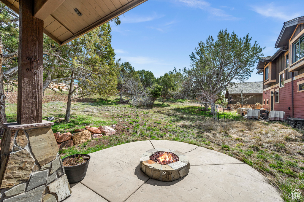 View of terrace featuring a fire pit