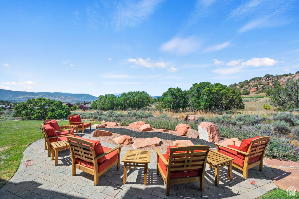 View of patio / terrace with a mountain view