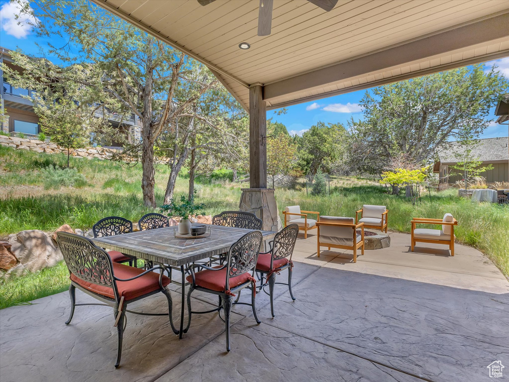 View of patio featuring a ceiling fan and outdoor dining space