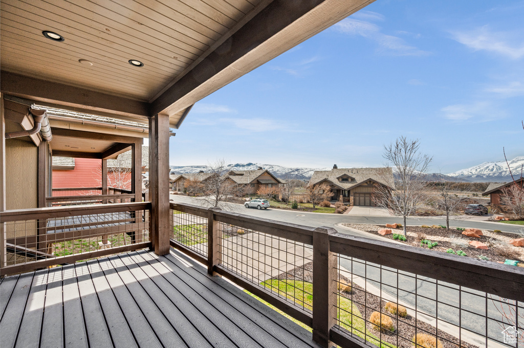 Wooden terrace featuring a mountain view