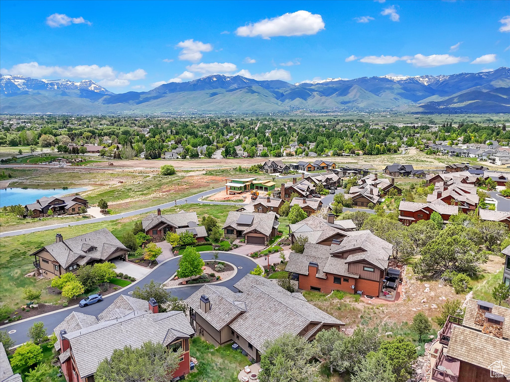 Aerial perspective of suburban area with a water and mountain view