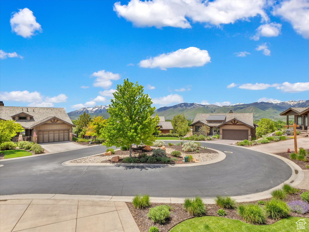 View of front of house with a mountain view and stone siding