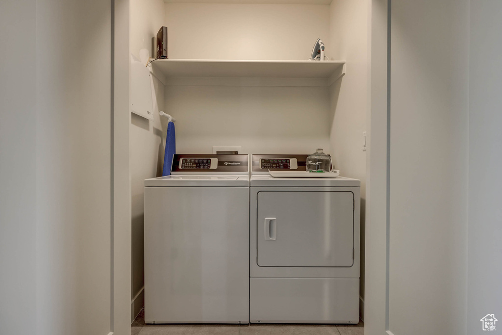 Washroom featuring washer and clothes dryer
