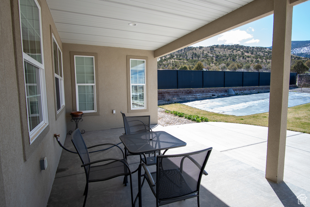 View of patio / terrace featuring pool water feature and a fenced in pool
