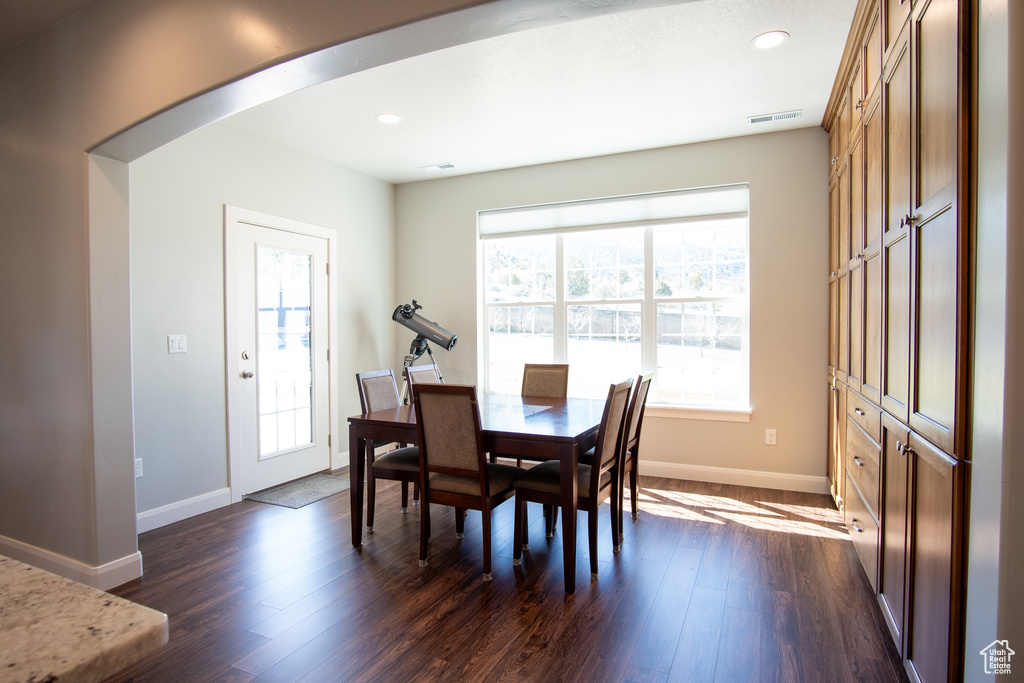 Dining space featuring dark hardwood / wood-style flooring