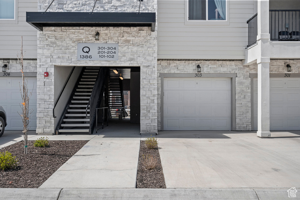 Entrance to property featuring a garage