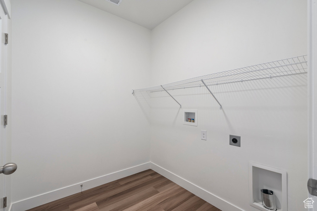 Laundry room with dark hardwood / wood-style floors, electric dryer hookup, and hookup for a washing machine
