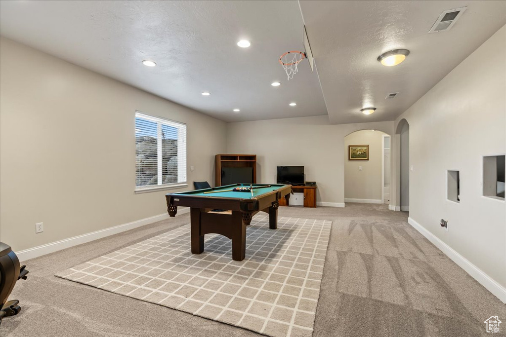 Game room with light colored carpet and billiards