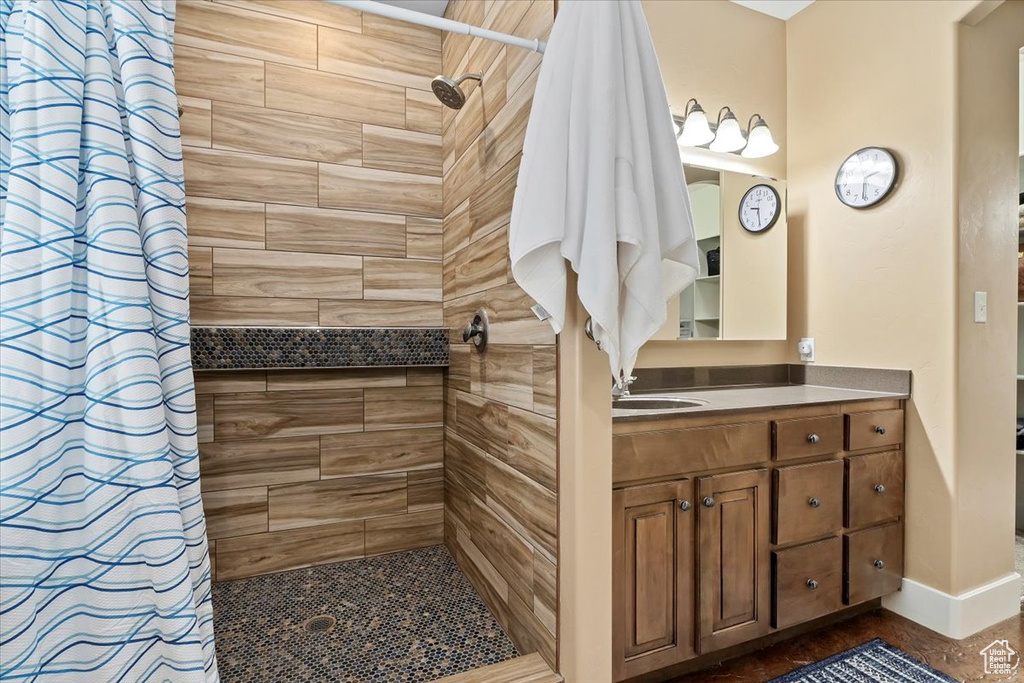 Bathroom with vanity and a shower with curtain