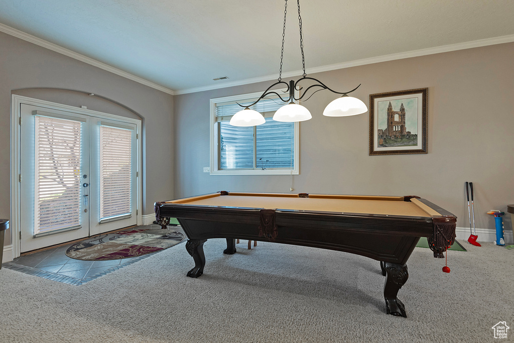 Playroom featuring ornamental molding, pool table, french doors, and carpet