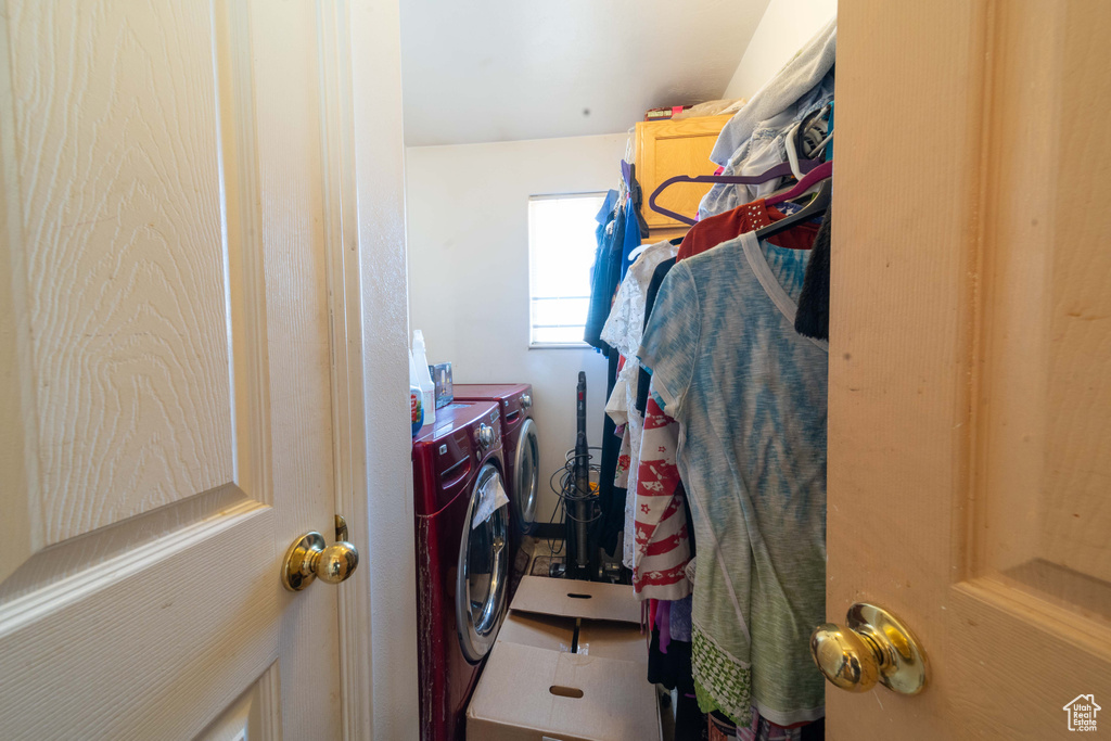 Spacious closet featuring tile floors and washer and dryer