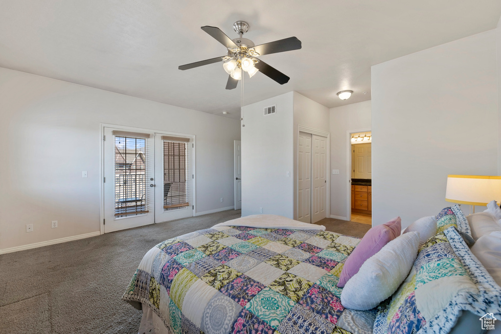 Carpeted bedroom featuring ceiling fan, access to outside, and a closet