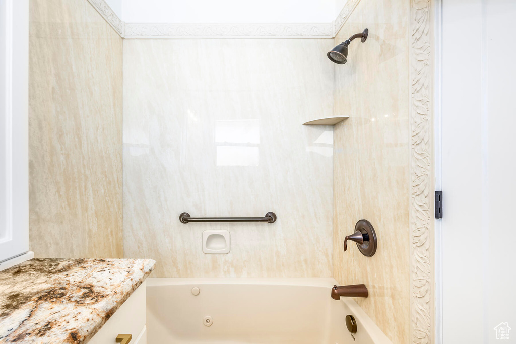 Bathroom with bathtub / shower combination and vanity