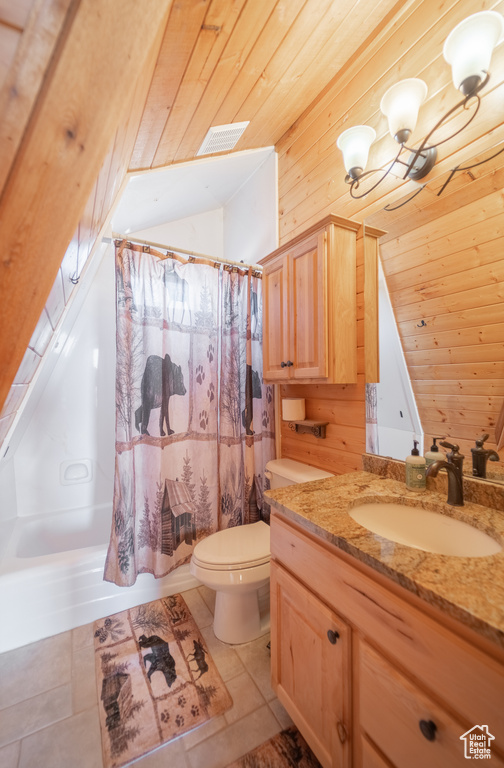 Full bathroom with wooden walls, tile flooring, wooden ceiling, and shower / bath combo