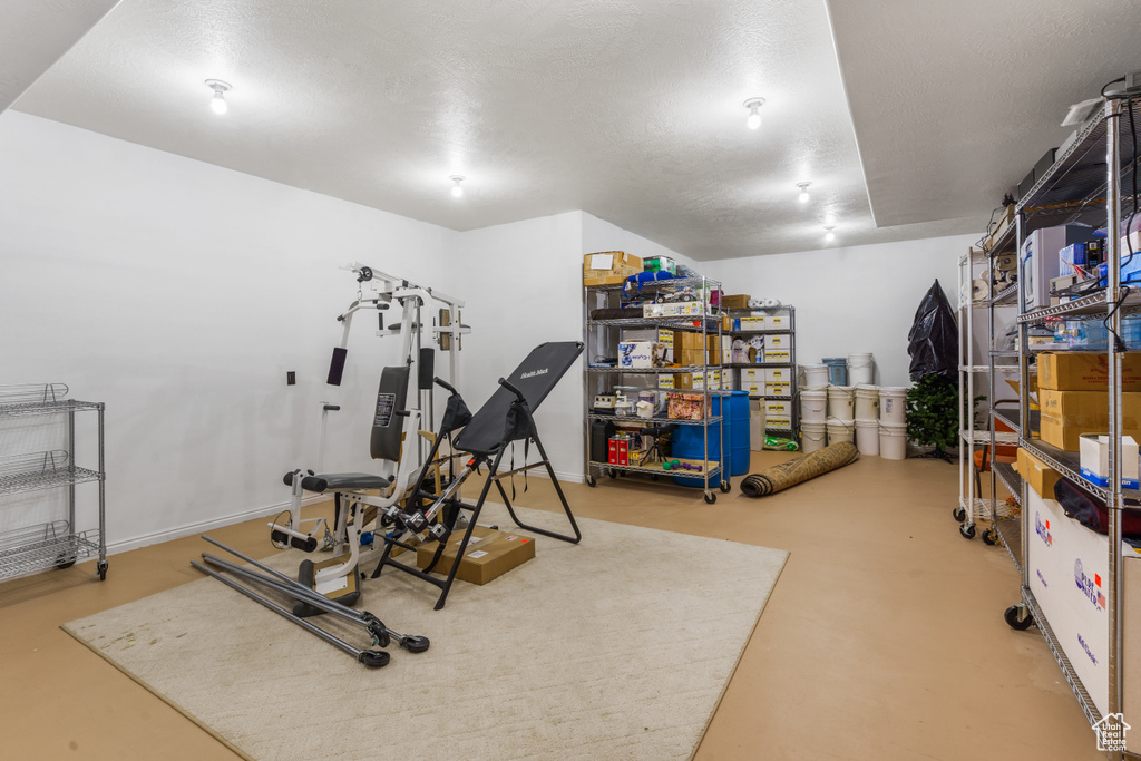 Exercise area with a textured ceiling