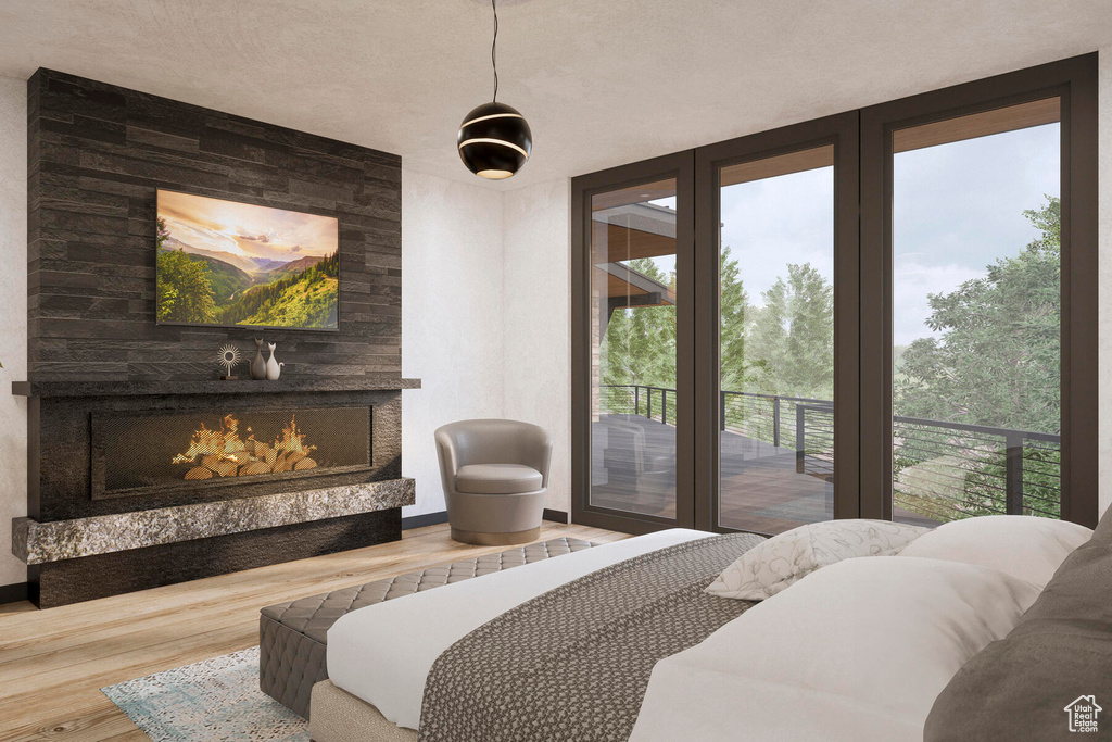 Bedroom with a textured ceiling, a large fireplace, wooden walls, access to outside, and wood-type flooring