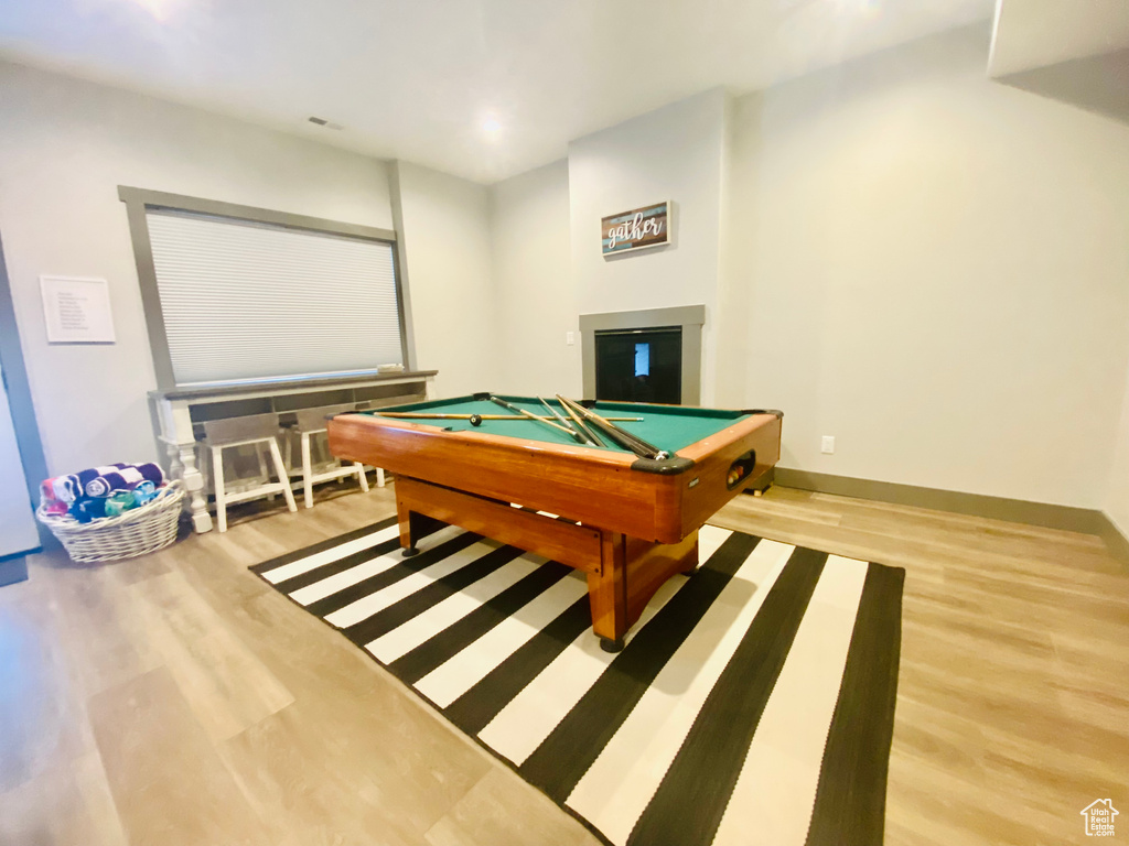 Playroom featuring light wood-type flooring and billiards