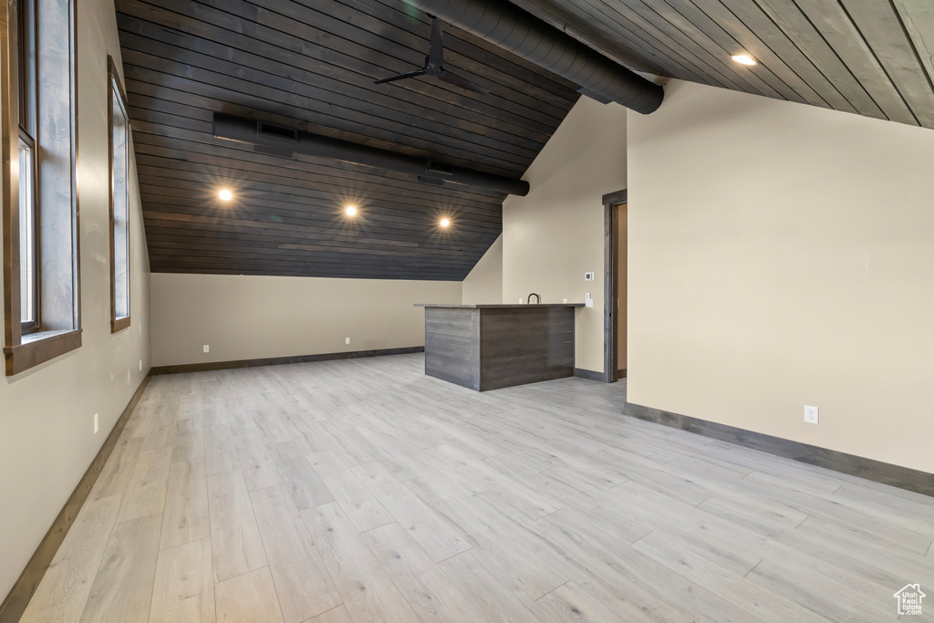 Interior space with wood ceiling, light hardwood / wood-style floors, and high vaulted ceiling