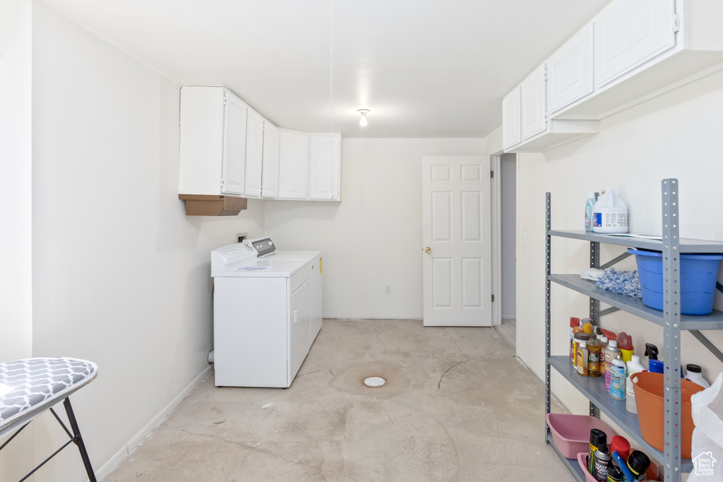 Laundry area with independent washer and dryer and cabinets