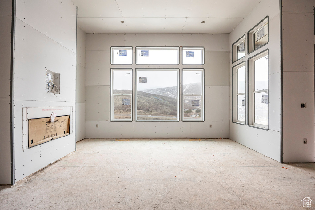 Spare room with a mountain view and plenty of natural light
