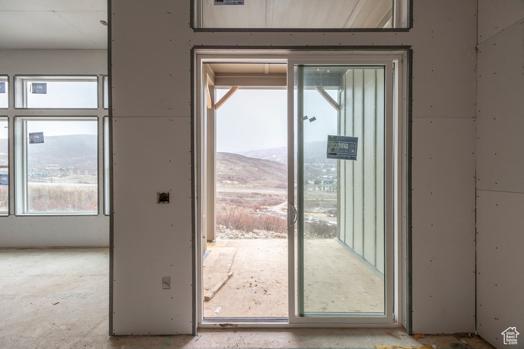 Doorway to outside featuring a mountain view
