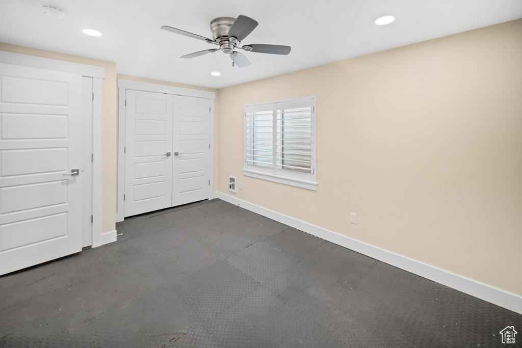 Unfurnished bedroom featuring a closet and ceiling fan