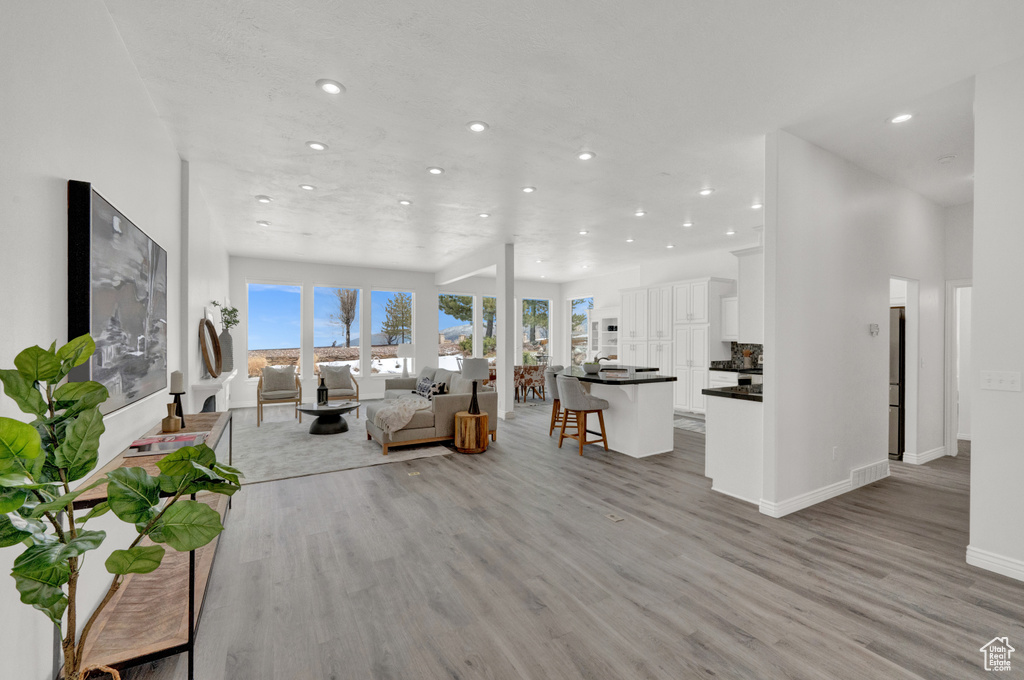 Unfurnished living room with light hardwood / wood-style floors