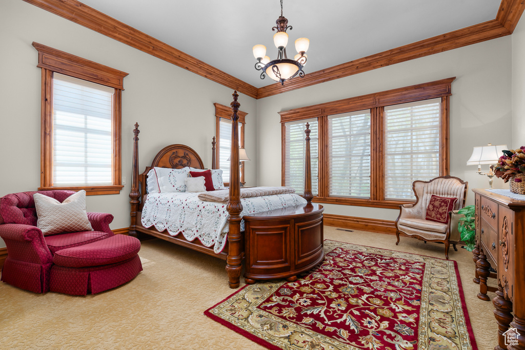 Bedroom featuring light carpet, a notable chandelier, multiple windows, and ornamental molding