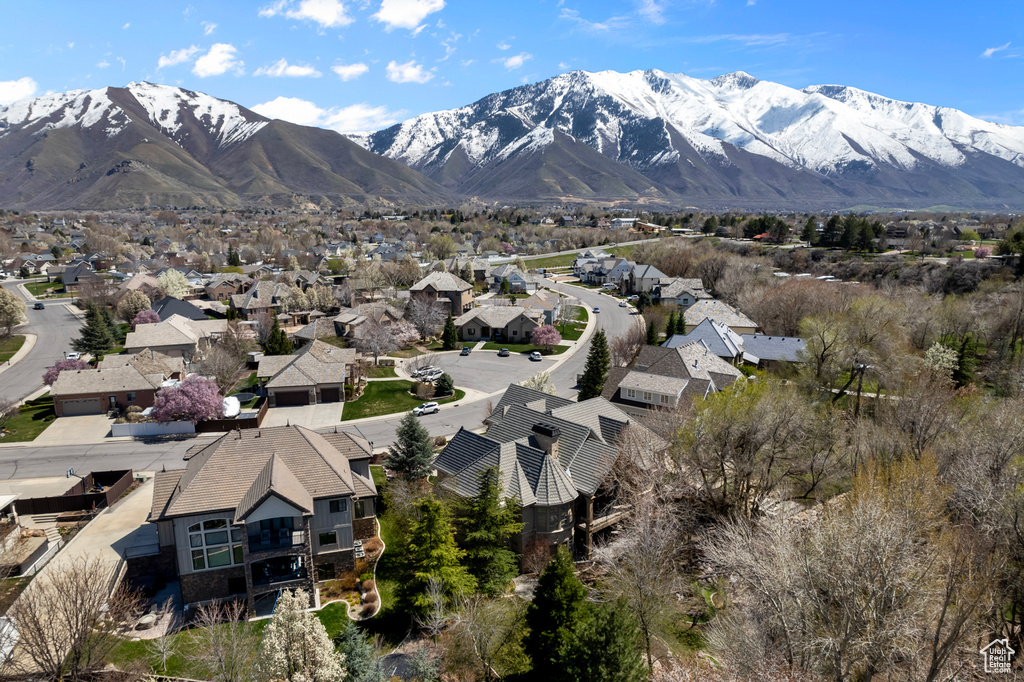 Birds eye view of property with a mountain view