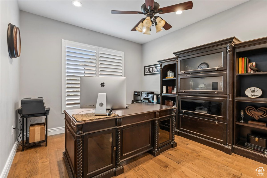 Office featuring light hardwood / wood-style flooring and ceiling fan