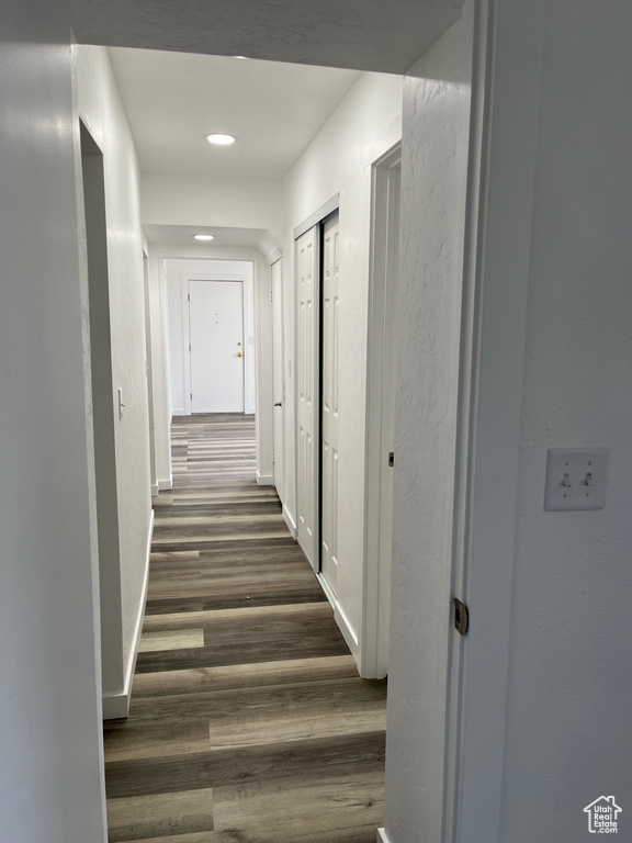 Corridor featuring dark hardwood / wood-style flooring