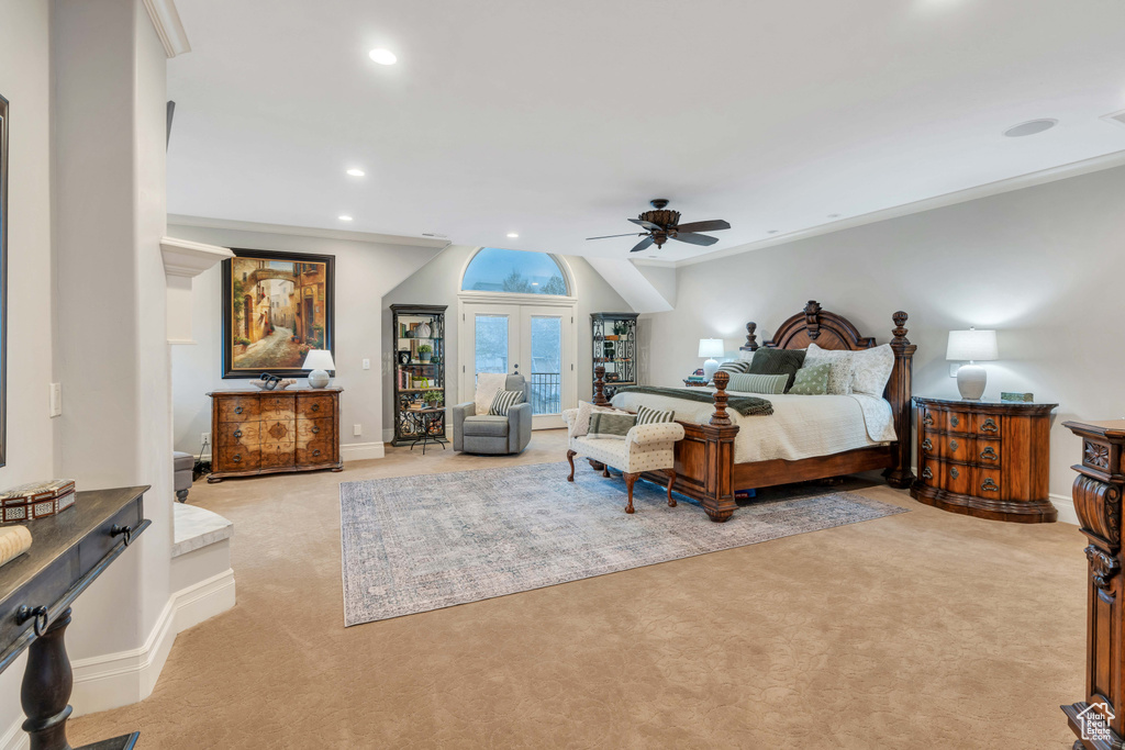 Carpeted bedroom with french doors, ornamental molding, and ceiling fan