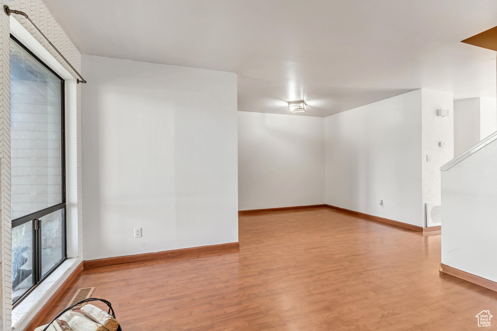 Spare room with light hardwood / wood-style floors