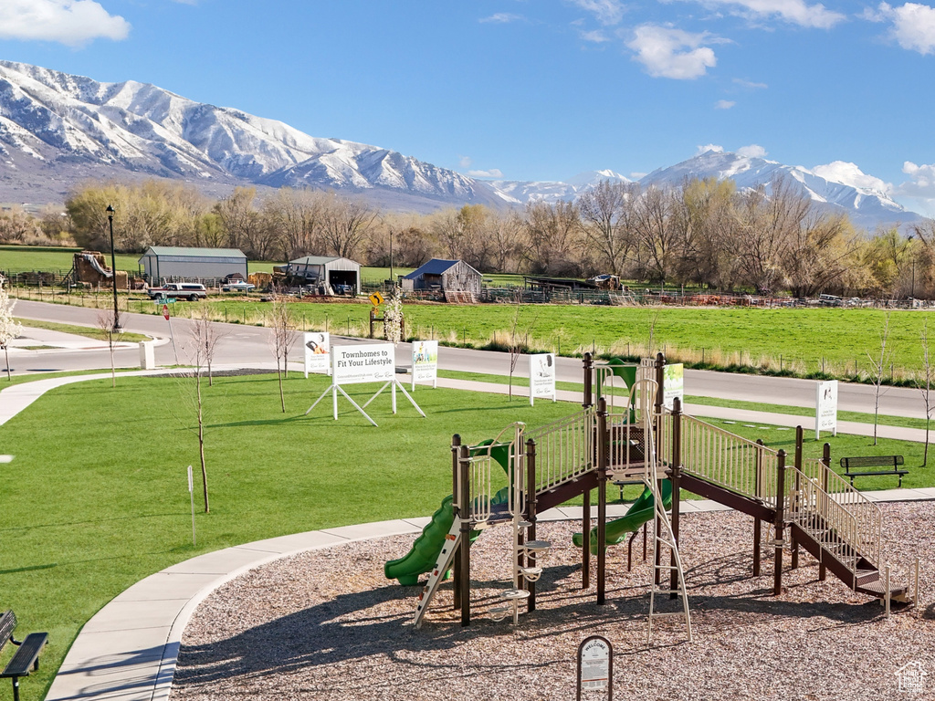 View of jungle gym featuring a mountain view