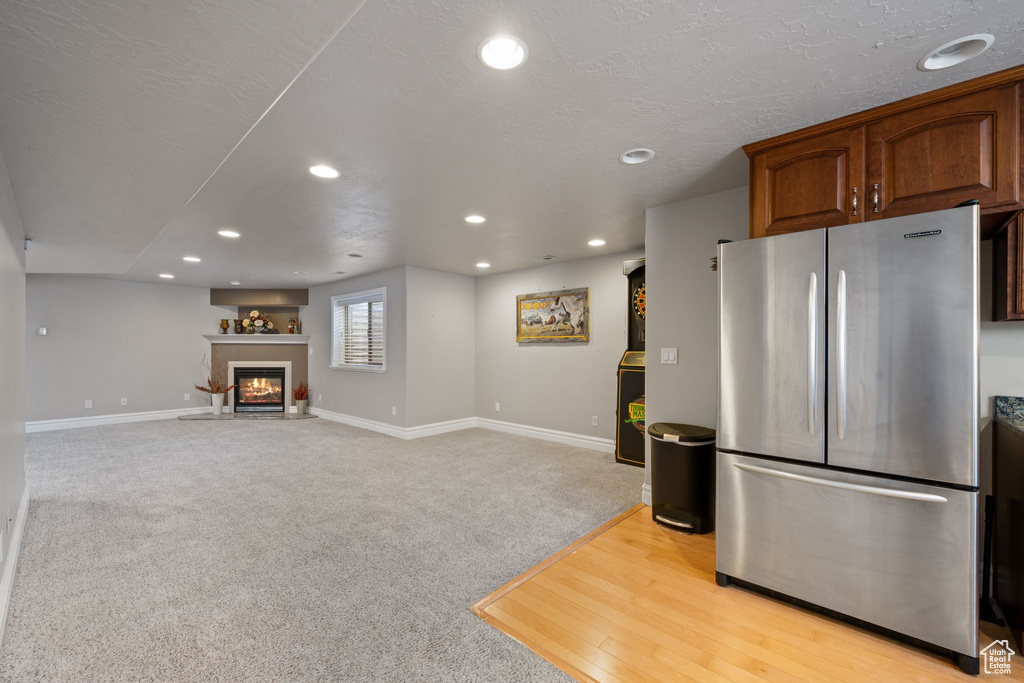 Kitchen featuring light hardwood / wood-style floors and stainless steel fridge