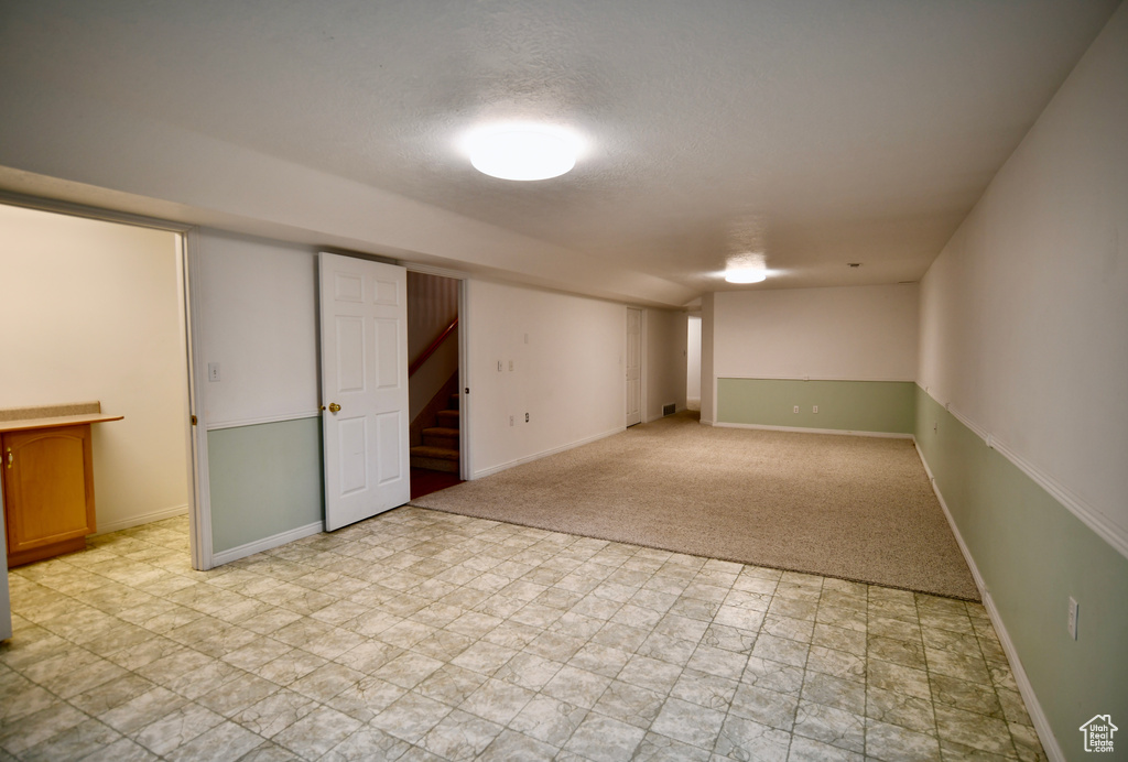 Basement featuring light tile floors