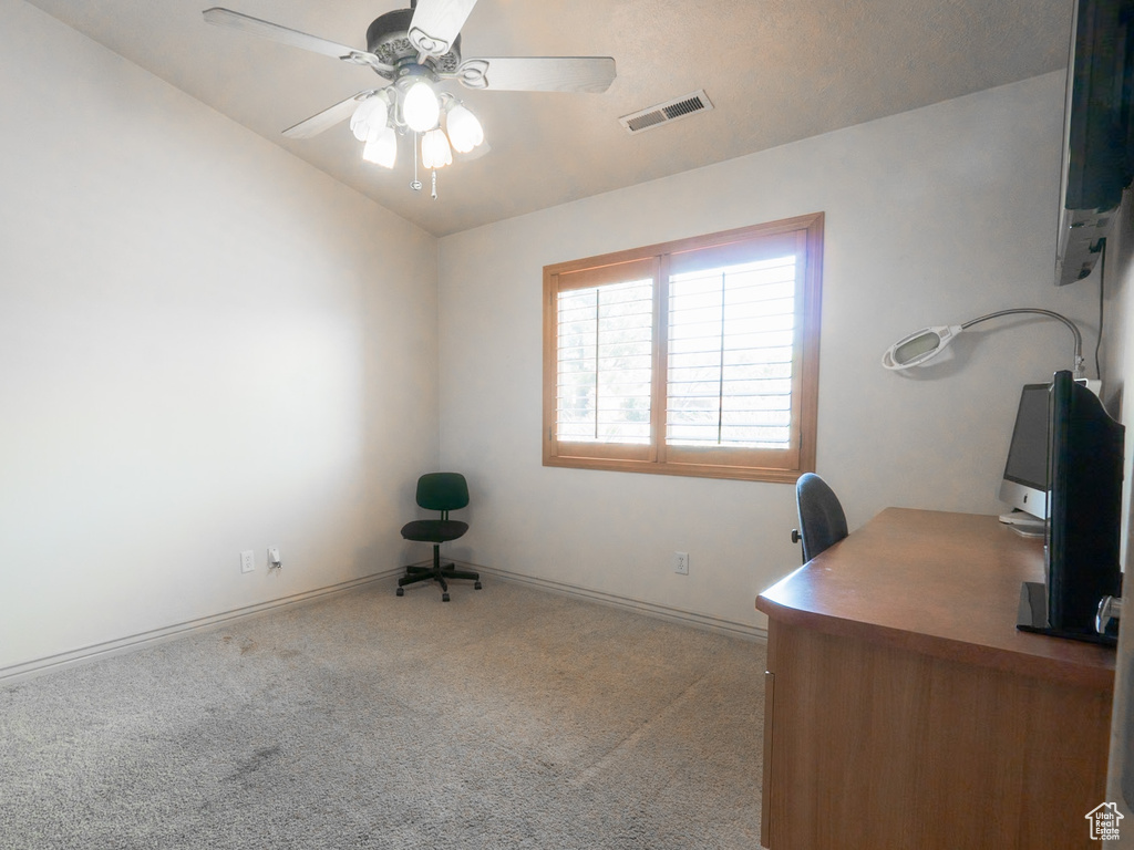 Office area featuring vaulted ceiling, ceiling fan, and carpet floors