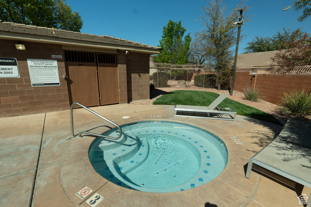 View of pool with a patio and a community hot tub