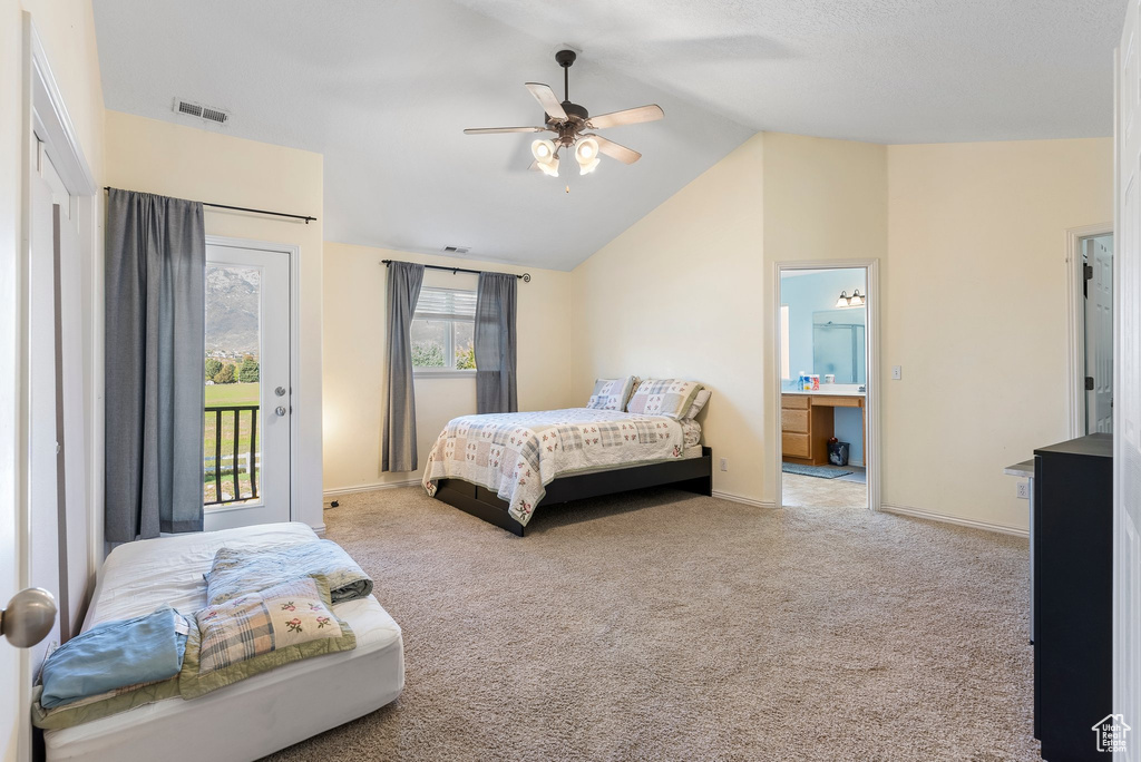 Bedroom featuring light colored carpet, lofted ceiling, ceiling fan, and access to exterior