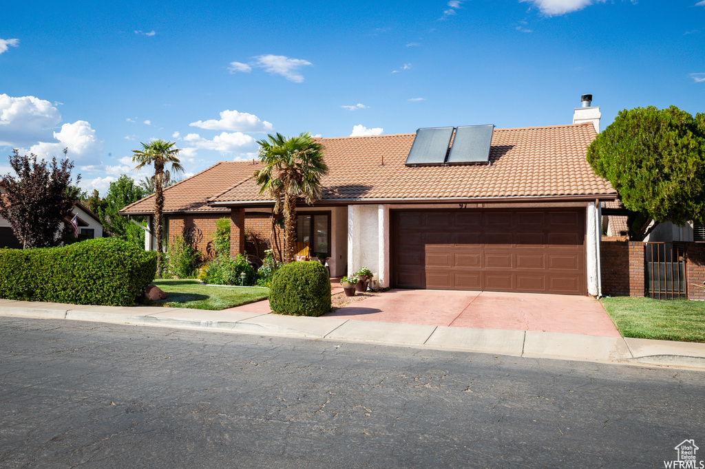 View of front of home featuring a garage