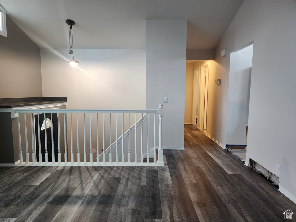 Corridor with dark hardwood / wood-style floors