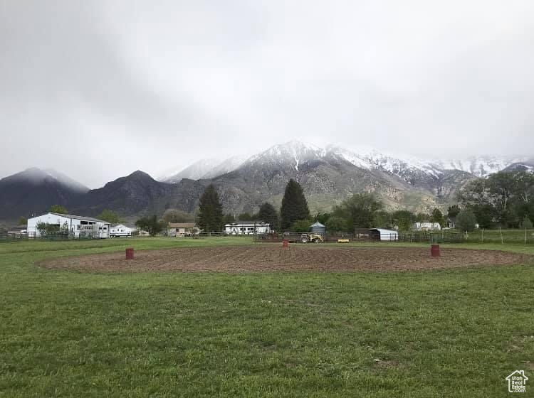 View of nearby features featuring a mountain view and a lawn