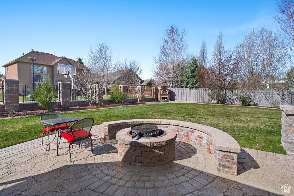 View of terrace featuring an outdoor fire pit