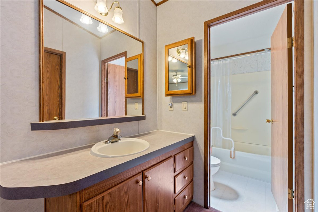 Full bathroom featuring shower / bathtub combination with curtain, toilet, tile flooring, and large vanity