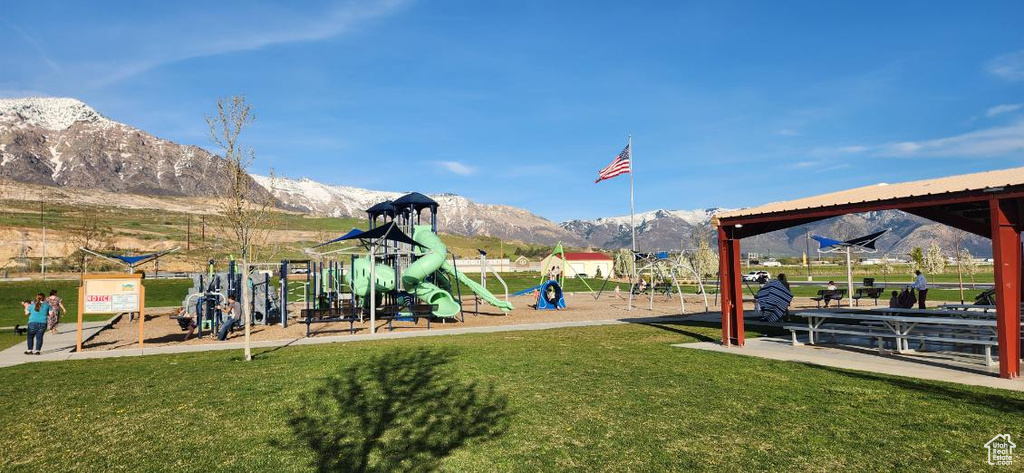 Exterior space with a mountain view and a playground
