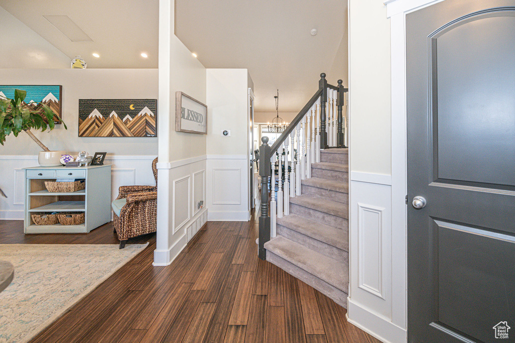 Stairway featuring dark hardwood / wood-style flooring