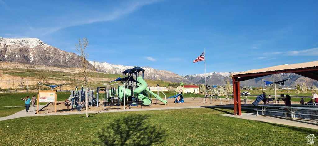 Exterior space featuring a mountain view and a playground