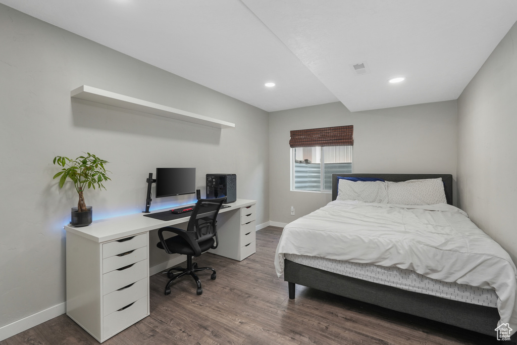 Bedroom featuring wood-type flooring