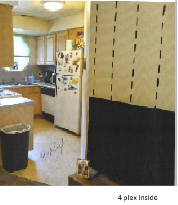 Kitchen featuring light brown cabinets and white fridge