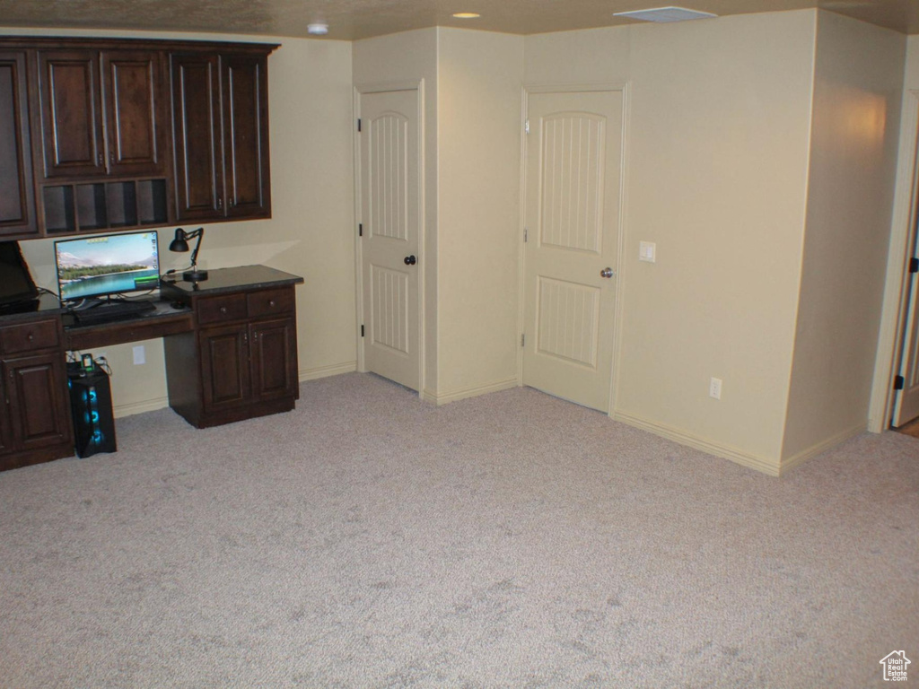 Unfurnished office with light colored carpet